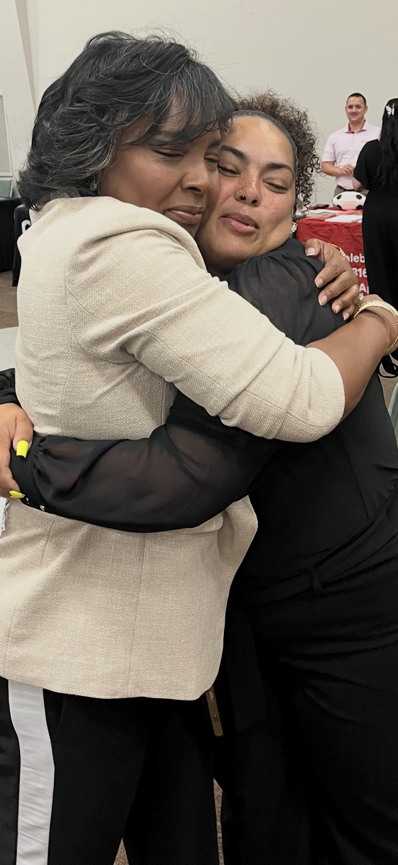 Dr. Yolanda White embracing a community member